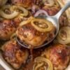 Juicy baked chicken thighs served over tender caramelized sweet onion rings, coated in a glossy savory-sweet sauce. A simple 3-ingredient chicken dinner in a white baking dish.