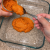 n easy 4-ingredient pumpkin dump cake recipe made with canned pumpkin puree, sweetened condensed milk, spice cake mix, and melted butter in one glass dish. A fudgy pumpkin base under a buttery crumb topping, no crust and no mixer, serves 10, and costs about 78 cents a slice. Perfect for Thanksgiving and easy to freeze unbaked