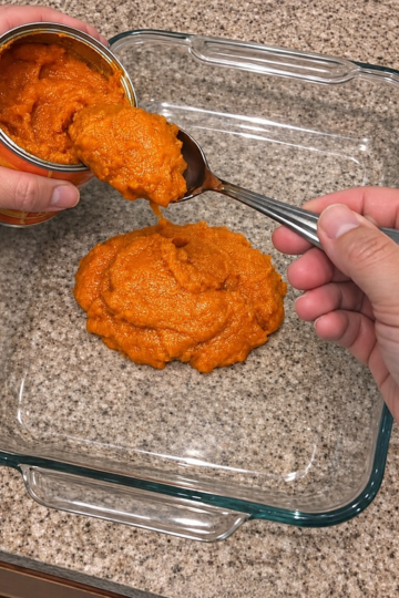 n easy 4-ingredient pumpkin dump cake recipe made with canned pumpkin puree, sweetened condensed milk, spice cake mix, and melted butter in one glass dish. A fudgy pumpkin base under a buttery crumb topping, no crust and no mixer, serves 10, and costs about 78 cents a slice. Perfect for Thanksgiving and easy to freeze unbaked