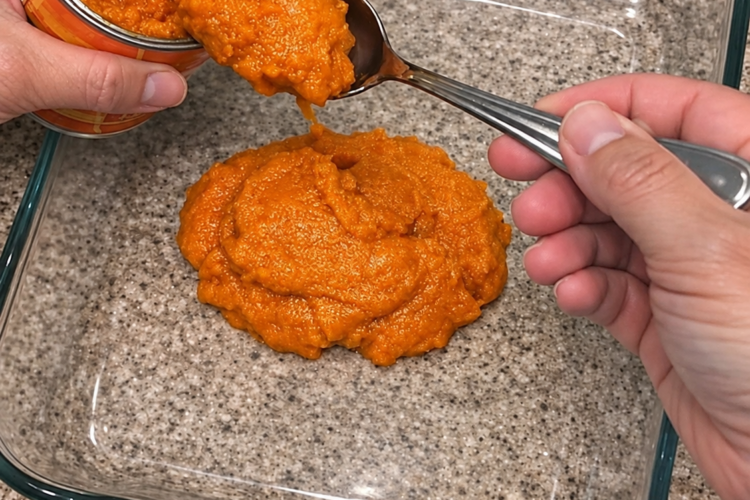 n easy 4-ingredient pumpkin dump cake recipe made with canned pumpkin puree, sweetened condensed milk, spice cake mix, and melted butter in one glass dish. A fudgy pumpkin base under a buttery crumb topping, no crust and no mixer, serves 10, and costs about 78 cents a slice. Perfect for Thanksgiving and easy to freeze unbaked