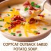 A creamy loaded baked potato soup topped with melted cheddar cheese, crispy bacon pieces, and fresh green onions, with a spoonful being lifted to show its rich, velvety texture.