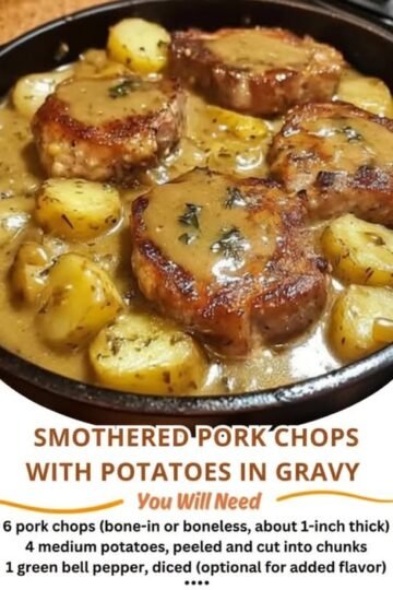 A comforting skillet of golden-browned smothered pork chops nestled among tender potatoes and coated in a rich, savory herb gravy.