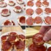 Golden-brown pepperoni pizza bites with crispy edges, gooey melted cheese, and savory pepperoni, served warm with marinara sauce for dipping