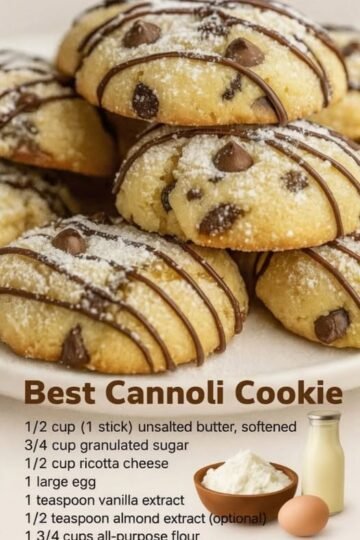 Soft, golden cannoli cookies studded with chocolate chips, dusted with powdered sugar, and finished with delicate drizzles of melted chocolate.