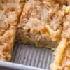 Golden-brown crumb cake bars with a buttery, tender center and a crisp, lightly caramelized topping, baked in a rectangular pan and cut into squares.