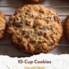 A stack of chunky, golden-brown 10-cup cookies packed with chocolate chips and crunchy pieces, featuring crisp edges and soft, chewy centers.