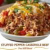 A hearty slice of stuffed pepper beef casserole loaded with seasoned ground beef, tender rice, colorful bell peppers, tomatoes, and melted cheddar cheese, finished with fresh parsley.