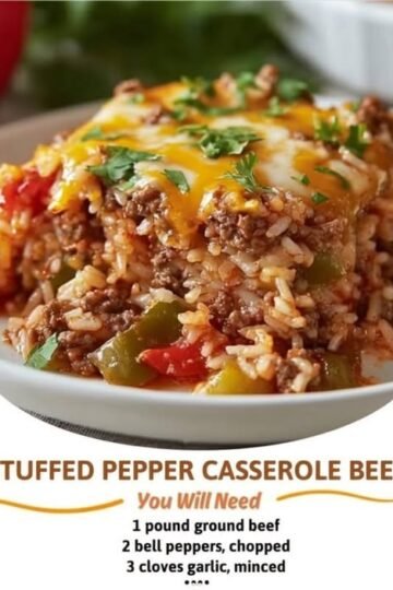 A hearty slice of stuffed pepper beef casserole loaded with seasoned ground beef, tender rice, colorful bell peppers, tomatoes, and melted cheddar cheese, finished with fresh parsley.