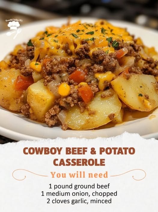 A hearty cowboy beef and potato casserole loaded with tender potatoes, seasoned ground beef, sweet corn, vegetables, and melted cheddar cheese, finished with fresh herbs for a comforting homestyle meal.