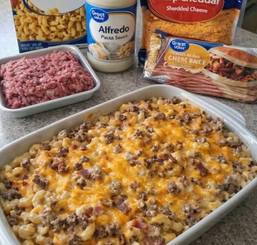 A creamy, cheesy beef and cavatappi pasta casserole made with Alfredo sauce, ground beef, sharp cheddar, and a rich, golden cheese topping, baked until bubbly and delicious