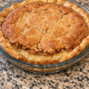 Grandma Helen's Sunday secret — a warmly spiced cake-like top over a soft, rich, gooey center in a buttery crust.