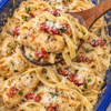 Tender chicken baked in a creamy sun-dried tomato sauce, tossed with pasta and plenty of Parmesan — all in one dish.