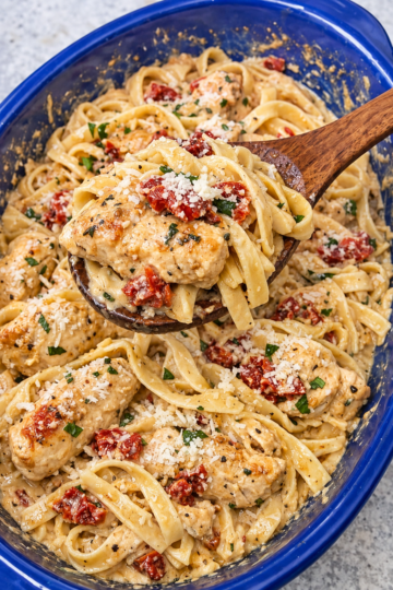 Tender chicken baked in a creamy sun-dried tomato sauce, tossed with pasta and plenty of Parmesan — all in one dish.