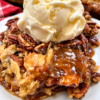 A buttery golden cake layer over melted butter and pecans, with a glossy brown sugar caramel sauce in the bottom of the dish. Eight ingredients, one pan, no frosting, and it feeds twelve for about 54 cents a scoop.