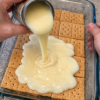 Whole graham cracker sheets, butter, and chocolate under a golden canopy of sweetened condensed milk — four ingredients, toasty and candy-like.