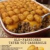 A hearty old-fashioned tater tot casserole in a red-and-white baking dish, topped with crispy golden tater tots and melted cheddar cheese over a creamy seasoned ground beef and onion filling.