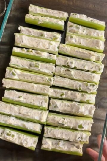 Cool, crisp celery filled with whipped herby cream cheese — ten minutes, zero cooking.