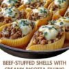 Tender jumbo shells filled with a rich beef-ricotta filling, baked under marinara and bubbling mozzarella — the everything-a-hug dinner.