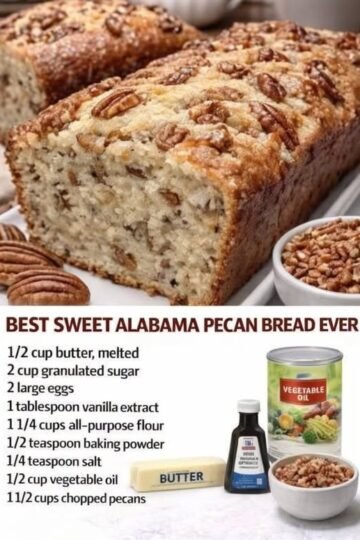 A freshly baked Sweet Alabama Pecan Bread with a golden-brown, slightly crisp crust, a soft, moist, buttery crumb packed with chopped pecans, and crunchy pecan halves scattered across the top.