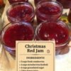 Several small jars of glossy, deep-red Christmas jam made with fresh cranberries, strawberries, sugar, and lemon juice, with visible pieces of fruit for a rustic homemade texture. littlehealthylife.com