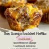 Golden-brown sausage breakfast muffins packed with savory breakfast sausage, fluffy egg, and melted cheddar cheese, with a tender biscuit-like center and crisp, cheesy tops. lanascooking.com