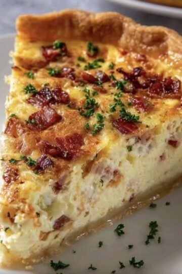 Golden, flaky Bacon and Cheese Quiche filled with a rich, creamy egg custard, smoky bacon pieces, and a sprinkle of fresh parsley. 🥓🧀 This comforting classic is perfect for breakfast, weekend brunch, or an easy family dinner!