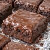 Rich, fudgy chocolate brownies topped with a thick layer of glossy, silky chocolate frosting. 🍫 These old-fashioned treats are wonderfully moist, deeply chocolatey, and perfect for sharing with family or enjoying with a glass of cold milk!