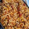 Hearty Old-Fashioned American Goulash made with tender elbow macaroni, savory ground beef, juicy tomatoes, and sweet corn in a rich tomato sauce. 🍅🍝 This comforting one-pan family favorite is budget-friendly, filling, and perfect for a cozy weeknight dinner!