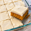 Warm, spiced, impossibly moist pumpkin cake crowned with tangy cream cheese frosting.