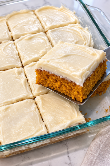 Warm, spiced, impossibly moist pumpkin cake crowned with tangy cream cheese frosting.