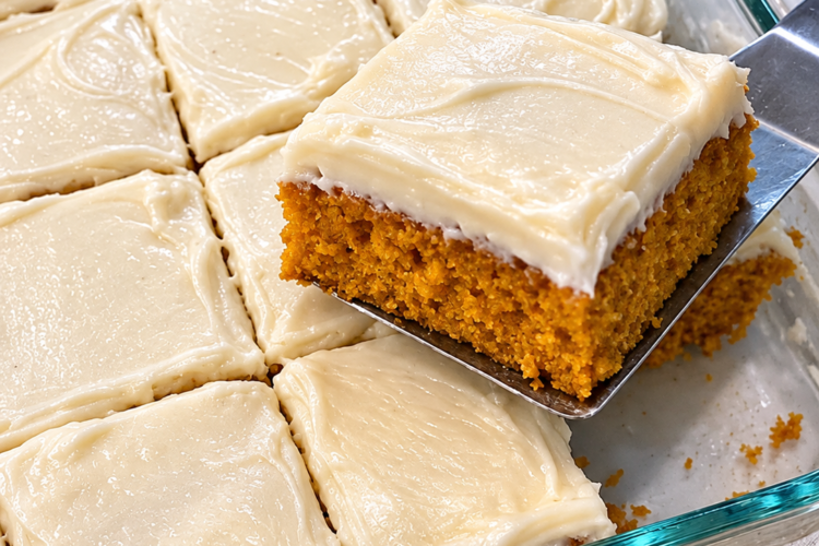 Warm, spiced, impossibly moist pumpkin cake crowned with tangy cream cheese frosting.