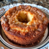 Yellow cake mix and dry vanilla pudding baked with a cinnamon sugar layer through the middle, then topped with more cinnamon sugar while hot so it melts into a crunchy shell as it cools. One bowl, one pan.