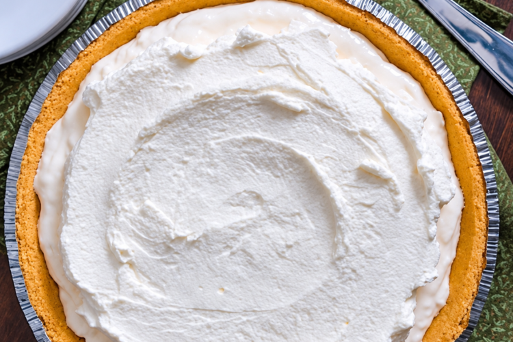 No-bake creamy white chocolate pie on a buttery graham cracker crust.