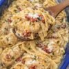 Creamy Tuscan-style chicken pasta with tender chicken, fettuccine, sun-dried tomatoes, Parmesan, and fresh herbs tossed in a rich, velvety garlic cream sauce.